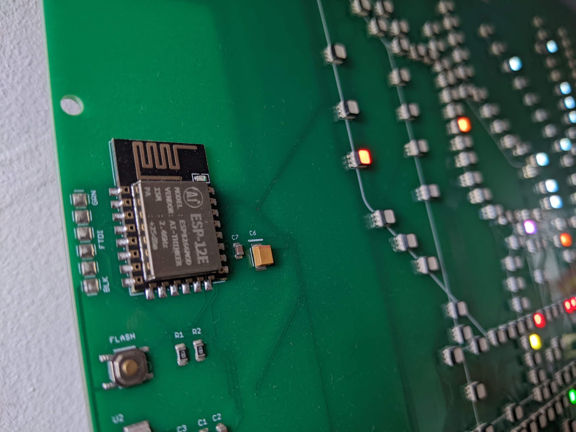 A small WiFi module is pictured at the side of the circuitboard, alongside smaller LED modules to indicate the board's status.