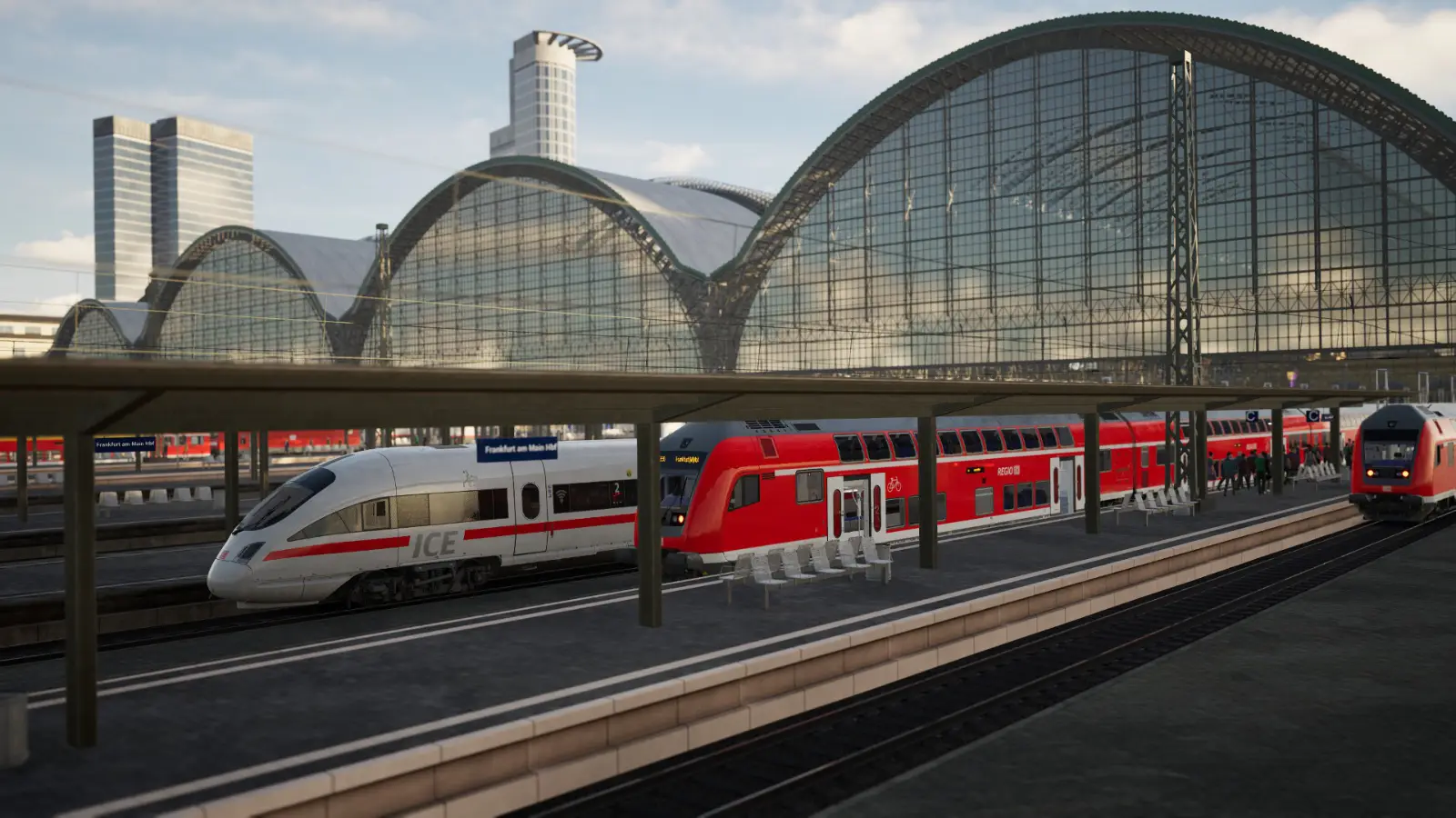 The grand train shed of Frankfurt (Main) Hauptbahnhof station houses numerous units, including the ICE-T. In the background the skyscrapers of Frankfurt tower over the station.