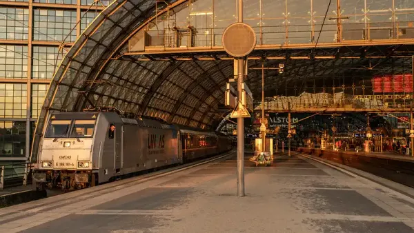 Early in the morning, at sunrise, the European Sleeper night train is stationary at Berlin Hauptbahnhof.